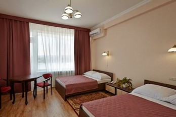 Кровать в номере двухместный улучшенный - санаторий имени Калинина города Ессентуки