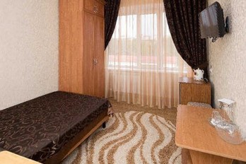 Спальня  в номере одноместный стандарт - санаторий Нива в Ессентуках