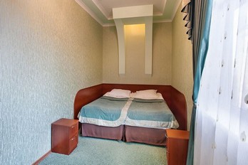 Спальня в номере 2-местный семейный с кухней - санаторий Бештау в городе-курорте Железноводске