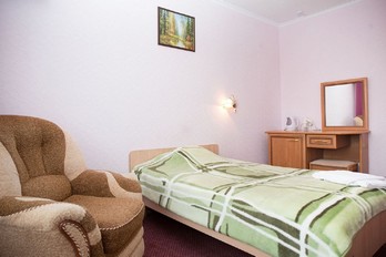 Кровать в номере одноместный первой категории - санаторий Эльбрус в городе Железноводск
