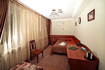 Спальня в одноместном однокомнатном номере без балкона в санатории Лесной - города Железноводск